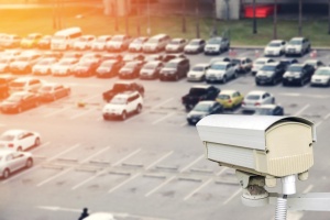 LPR cameras in an outdoor parking lot scanning vehicle license plates.